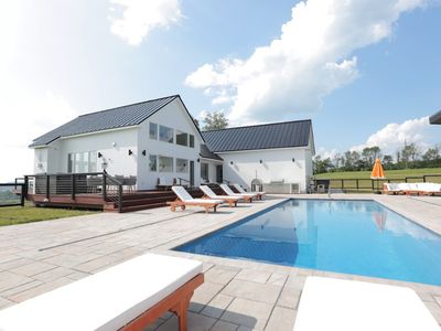 Upon arriving you'll get a glimpse of the beautiful pool as you head around the back to the main entrance!