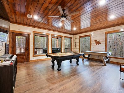 The game room is also found on the cabin's lowest level & has outdoor access.