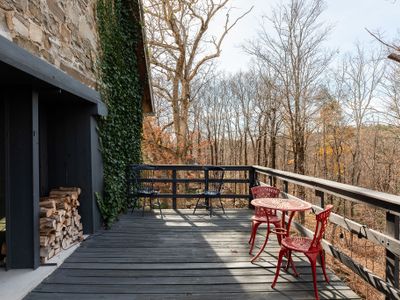 Enjoy the second story porch, the river lying just beyond the trees.