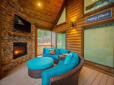 The outdoor sofa around the gas fireplace.