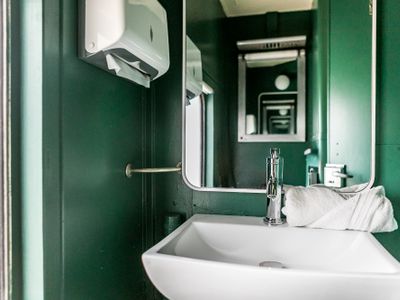 First bathroom located inside train car.