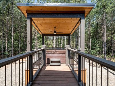 The hot tub is off the porch!