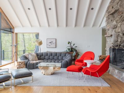 Lounge at ease between sweeping views and roaring fire.