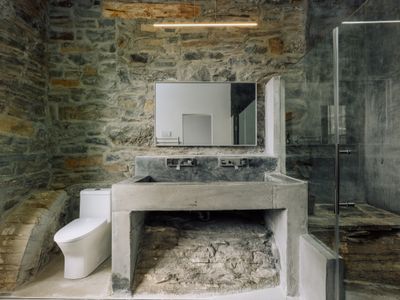 This remarkable bathroom highlights the original stone used to construct The Rifton.