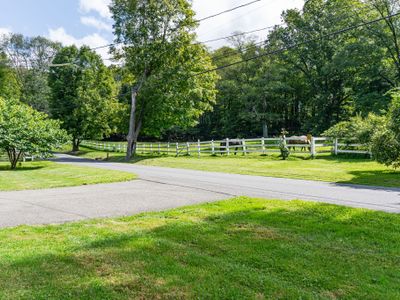 This idyllic horse pasture is steps from the front door