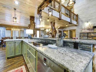 Kitchen is equipped with dual stovetops, two dishwashers and ample counter space