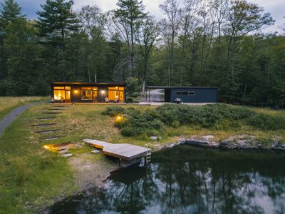 The cozy guest house across the pond with it's own carport