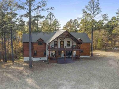 Views of the covered porch and private patio accessible on the upper floor.