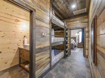 The hallway unveils 3 full-size bunk beds