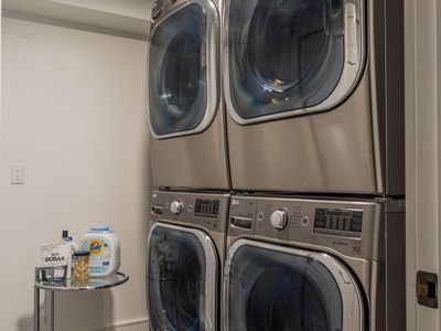 Additionally, you'll find dual washing machines and dryers on the bottom floor, just across from the lounge area.