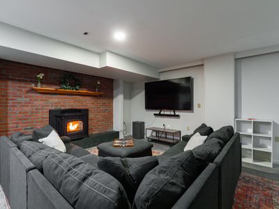 basement with pellet stove and unbelievably comfy couch!