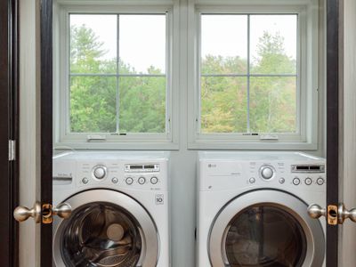 Washer & Dryer with views of the backyard.