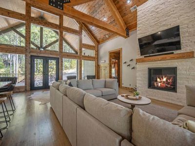 Oversized sectional around the tv and stone fireplace!