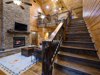 Upstairs leads to the loft and remaining bedrooms.