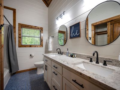 Just outside the bunk room is a full bathroom with double vanities!