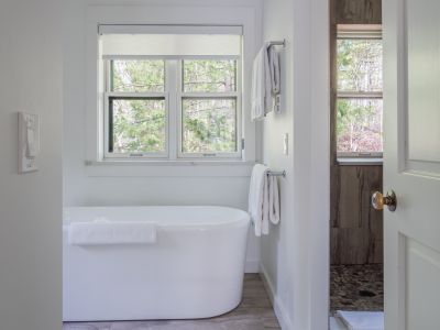 Full bathroom, complete with both bath and shower, adjacent to the primary bedroom on this private level.