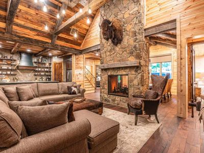 The fireplace separates the lodge room from the formal dining room.