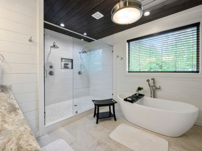 The private bathroom is equipped with an oversized tub and walk-in shower!