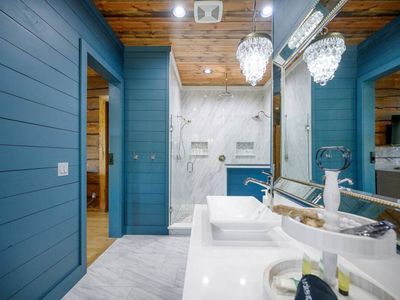 Double vanity and double-head walk-in shower.