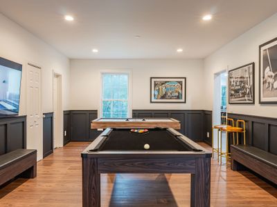 A fully-furnished gameroom with TV, billiards, fooseball, and a poker table!