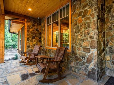 The front porch welcomes you with rocking chairs.