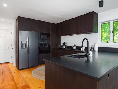 Head upstairs to the main floor and find yourself in the kitchen