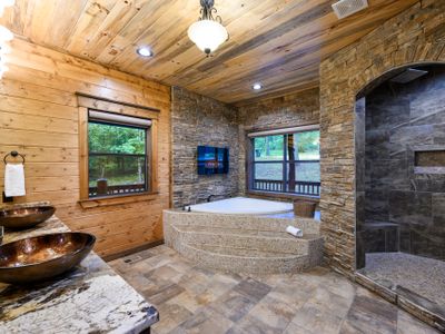 The private bathroom has a huge soaking tub and a walk-in shower.