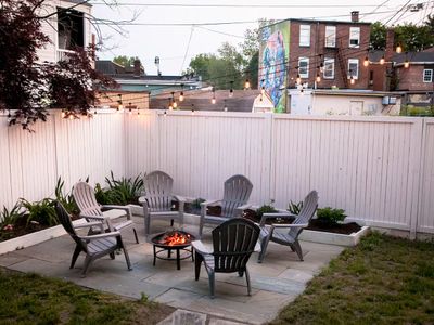 Unwind at night on the bluestone patio, perfect for bonfires under the lights in the heart of Kingston.