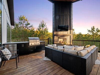 Oversized sectional around the gas fireplace and an outdoor kitchen!