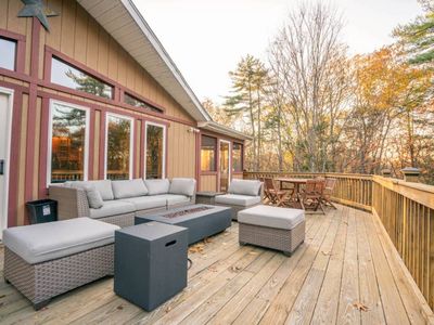 Outdoor lounge area with gas fireplace.