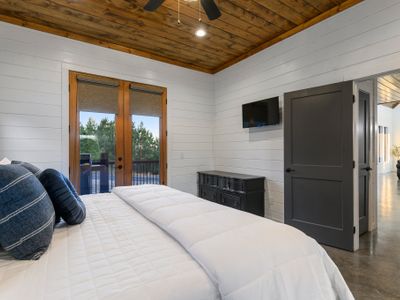 The lower level houses the Master suite with private access to the deck.