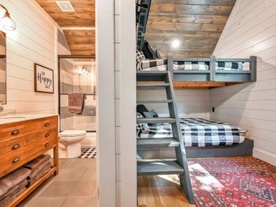 This bunk room also has a private bathroom.