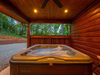 A luxury oversized hot tub on the covered patio.