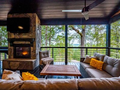 An outdoor fireplace is at the heart of the outdoor entertainment area.