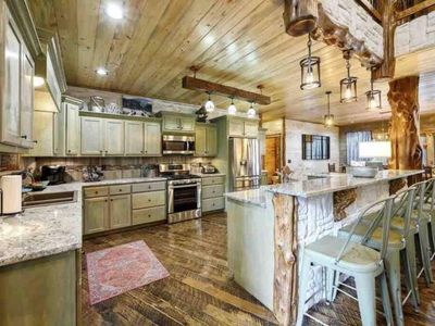 Every culinary enthusiast's dream kitchen + extra seating with 8 at the bartop!