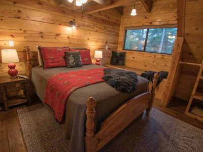 Upstairs you will find 1/4 bedrooms. Equipped with a Queen Bed.