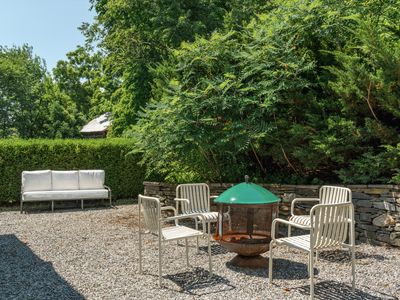 Relax by the fire pit on the patio, just off the back of the house.