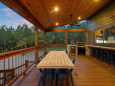 Outdoor dining table and kitchenette.