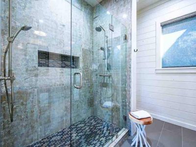 A double head walk-in shower for the private bathroom.