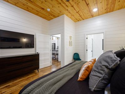 A dresser and smart tv come in the suite for guests to use.