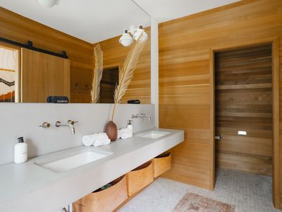 His & hers sinks and private toilet room