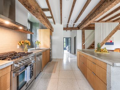 Modern amenities meet old world character in this open-concept kitchen.