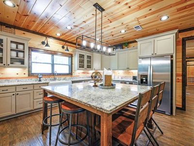 The kitchen comes with an oversized island that seats an additional 7.