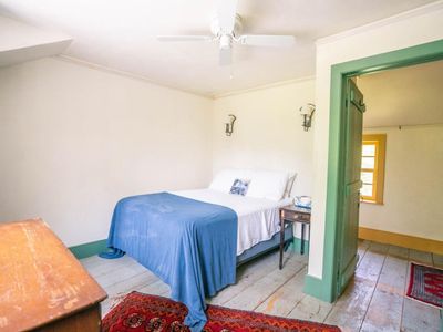 2nd floor back guest bedroom with full sized bed.