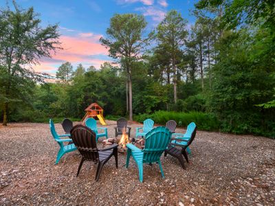 A fire pit with chairs.