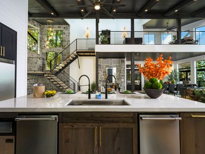 The kitchen is equipped with two dishwashers.