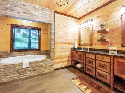 The Master bathroom with a double vanity and soaking tub.