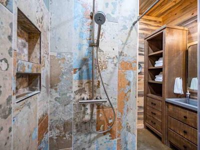 Private bath with a walk-in shower.