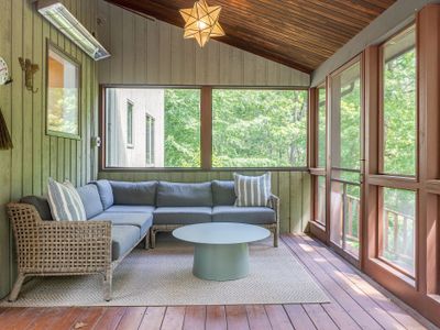 An enclosed porch allows you to be close to nature without worry of bugs.