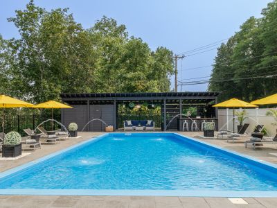 A lounge, bar, and poolside powder room complete the setup for a perfect afternoon.